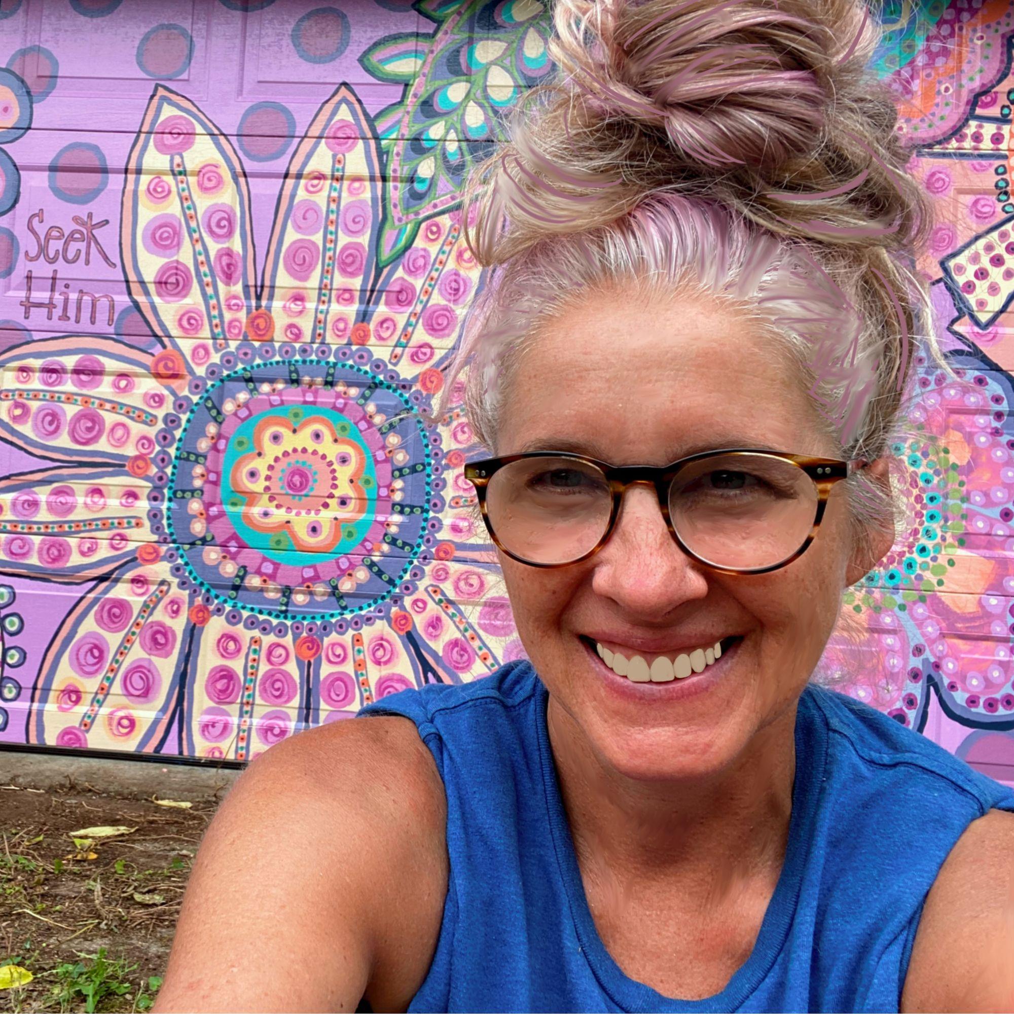 Katie, artist and founder of Art Inspirations, creating faith-based hand-lettered scripture art